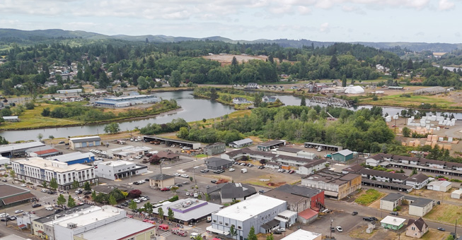 Image showing the Raymond mill with a clearning showing where the housing will be built.